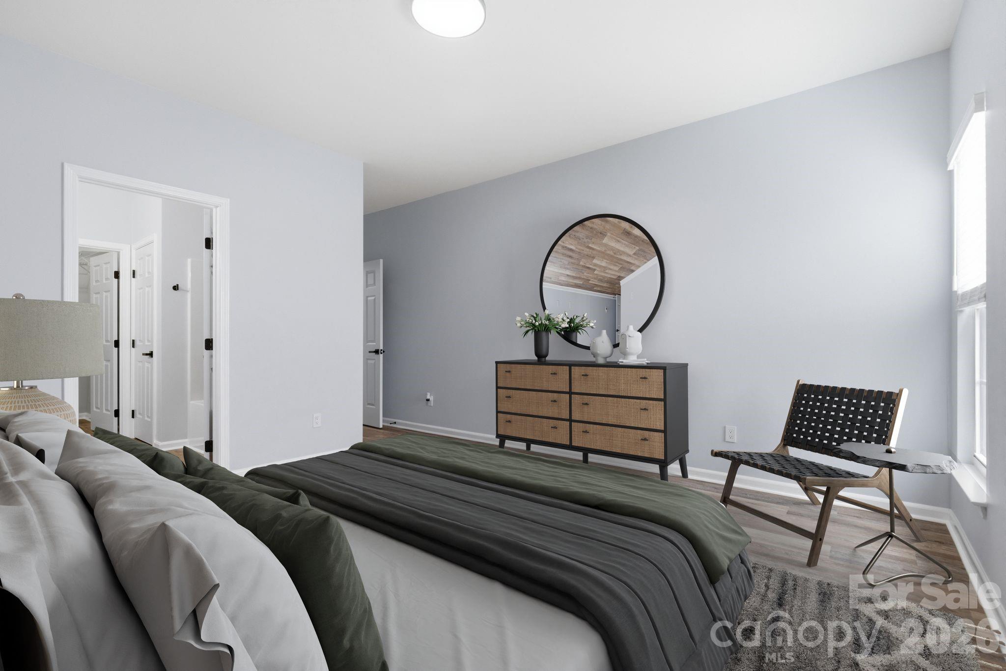 7978 Mariners Pointe Circle Denver, NC 28037 - Photo 20 of 37 a bedroom with a bed and a chair