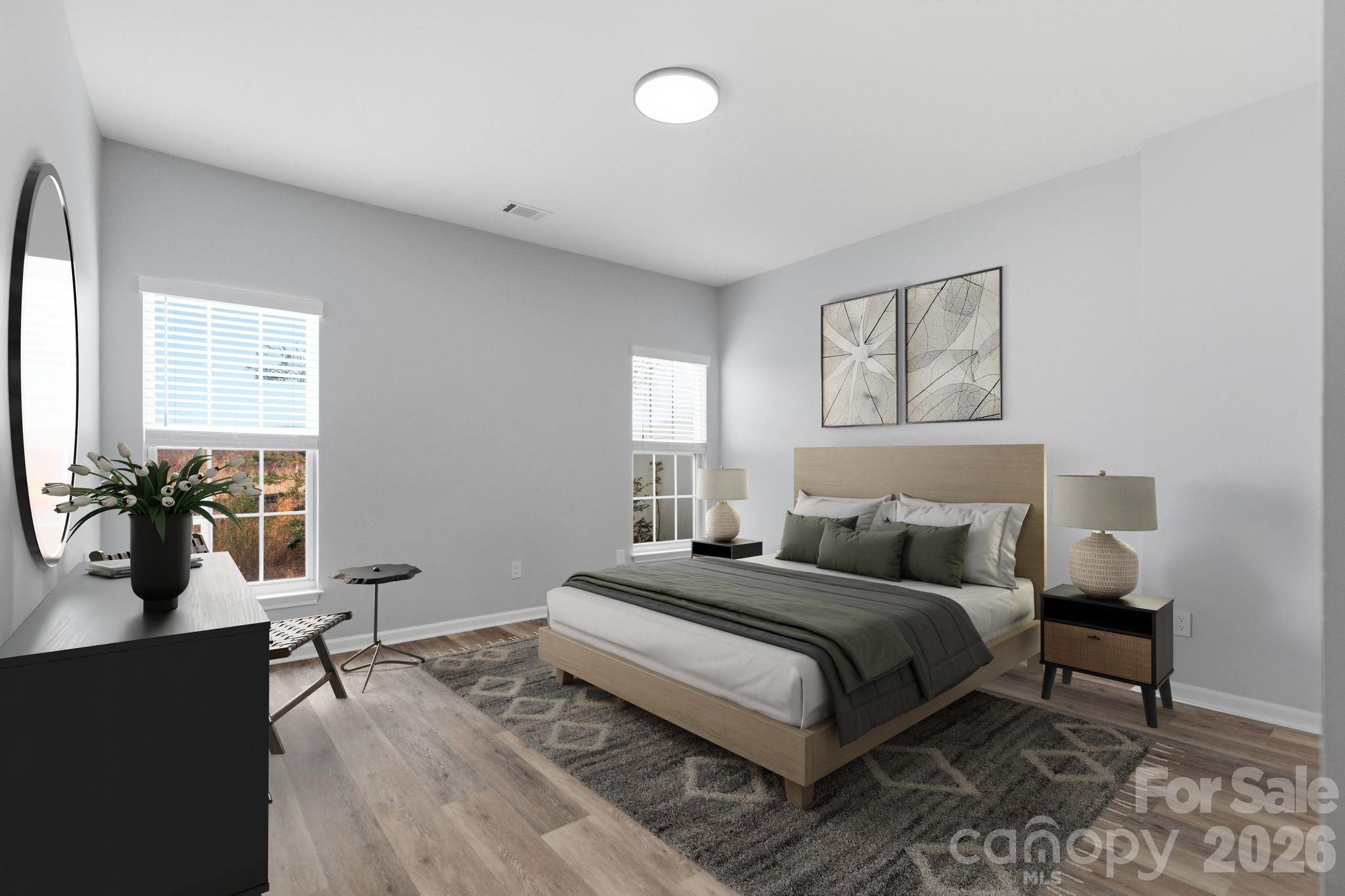 7978 Mariners Pointe Circle Denver, NC 28037 - Photo 21 of 37 a bedroom with a bed and wooden floor