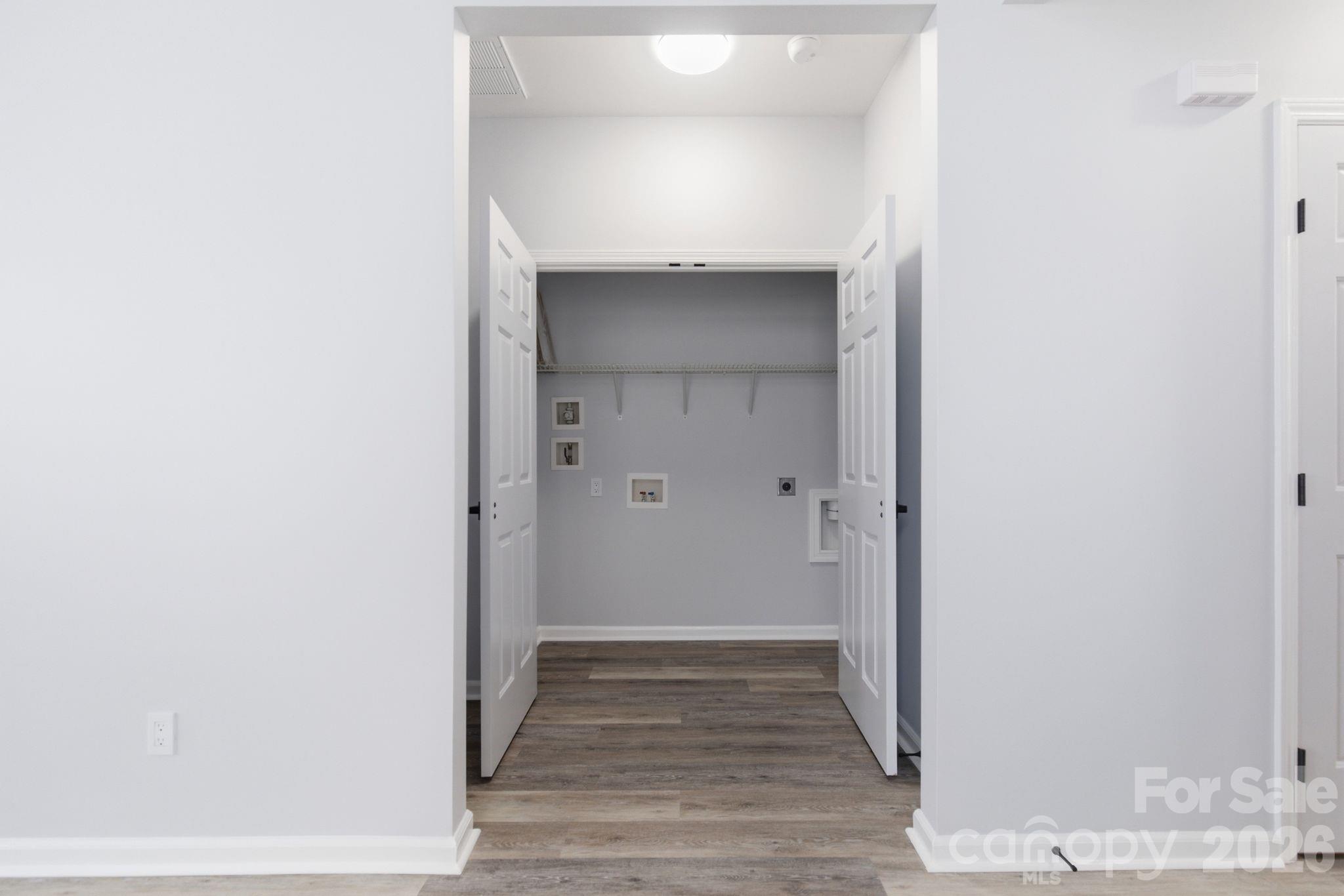 7978 Mariners Pointe Circle Denver, NC 28037 - Photo 22 of 37 a view of a hallway with wooden floor