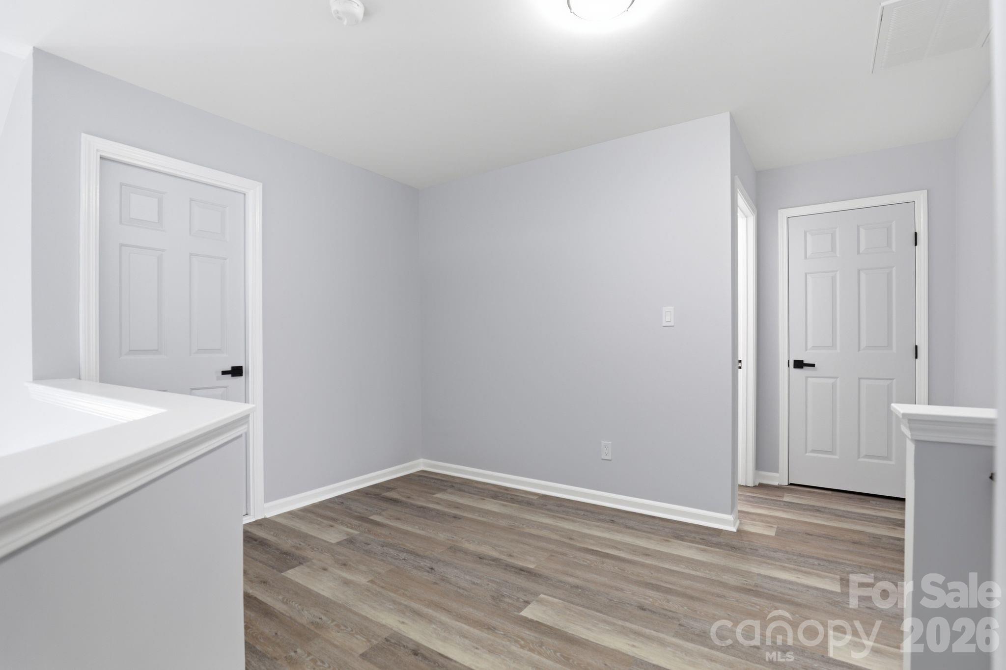 7978 Mariners Pointe Circle Denver, NC 28037 - Photo 23 of 37 a view of empty room with wooden floor