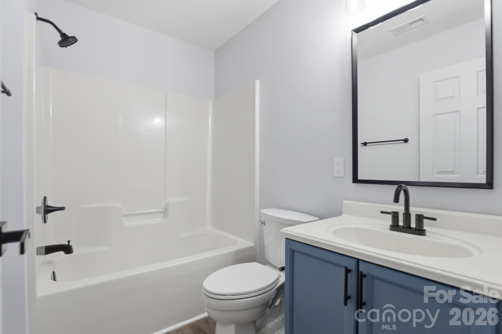 7978 Mariners Pointe Circle Denver, NC 28037 - Photo 26 of 37 a bathroom with a sink a toilet and shower
