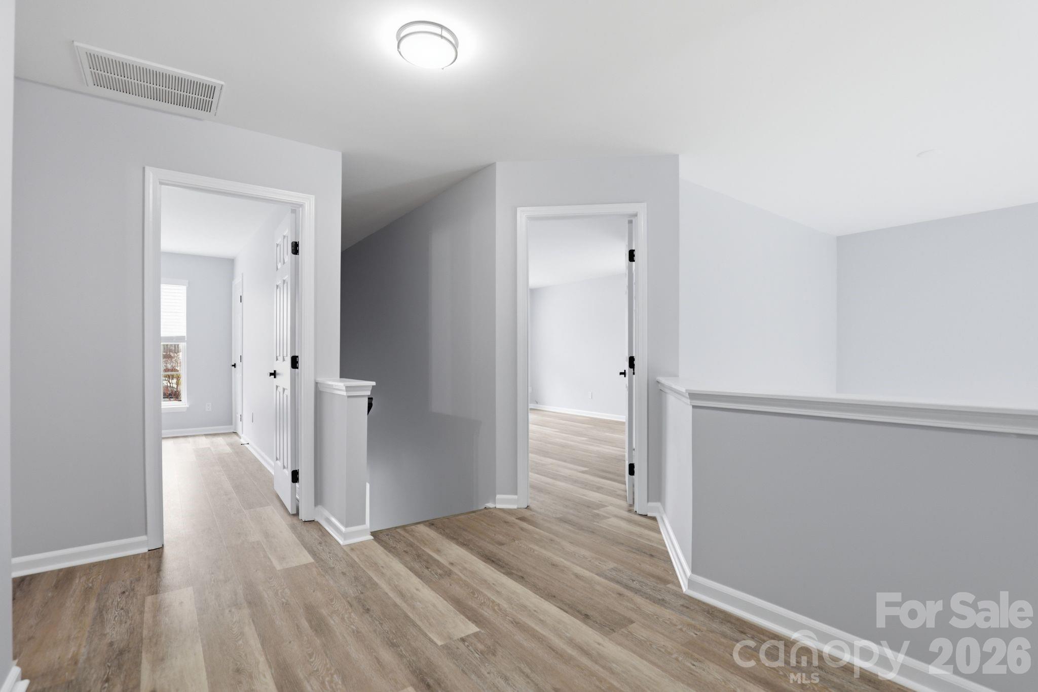 7978 Mariners Pointe Circle Denver, NC 28037 - Photo 28 of 37 a view of a hallway with wooden floor