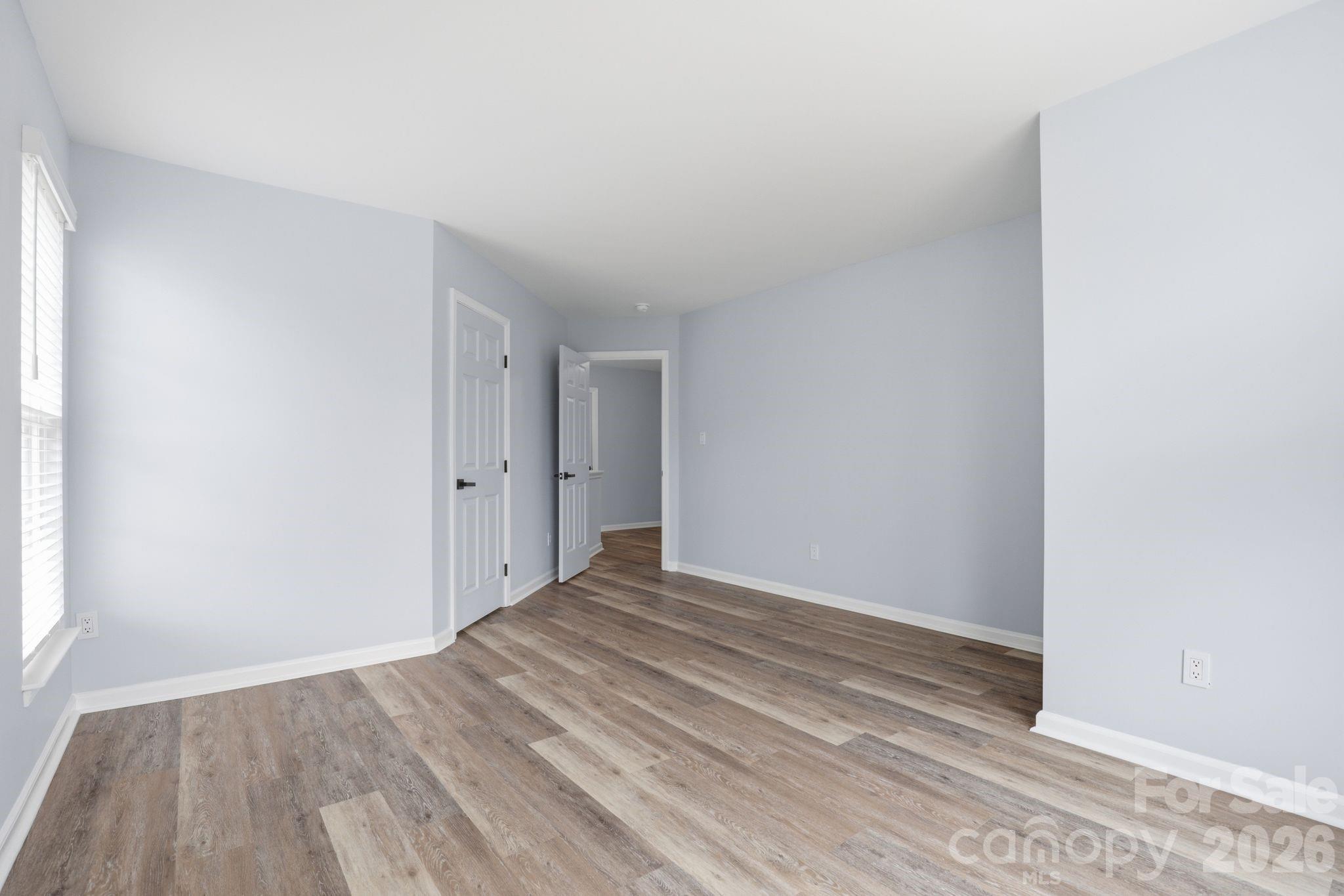 7978 Mariners Pointe Circle Denver, NC 28037 - Photo 31 of 37 a view of an empty room with wooden floor
