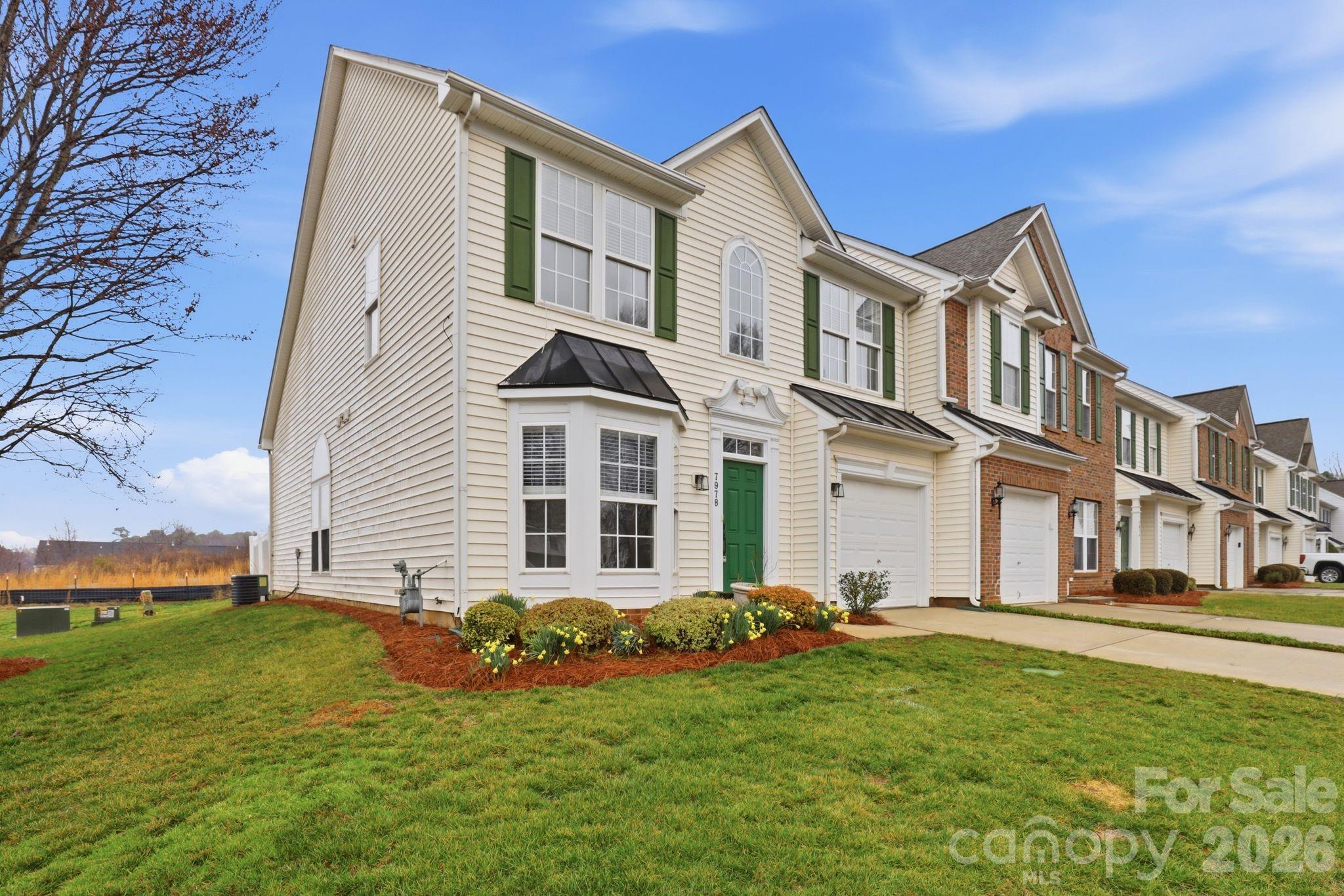 7978 Mariners Pointe Circle Denver, NC 28037 - Photo 35 of 37 a front view of a house with a garden