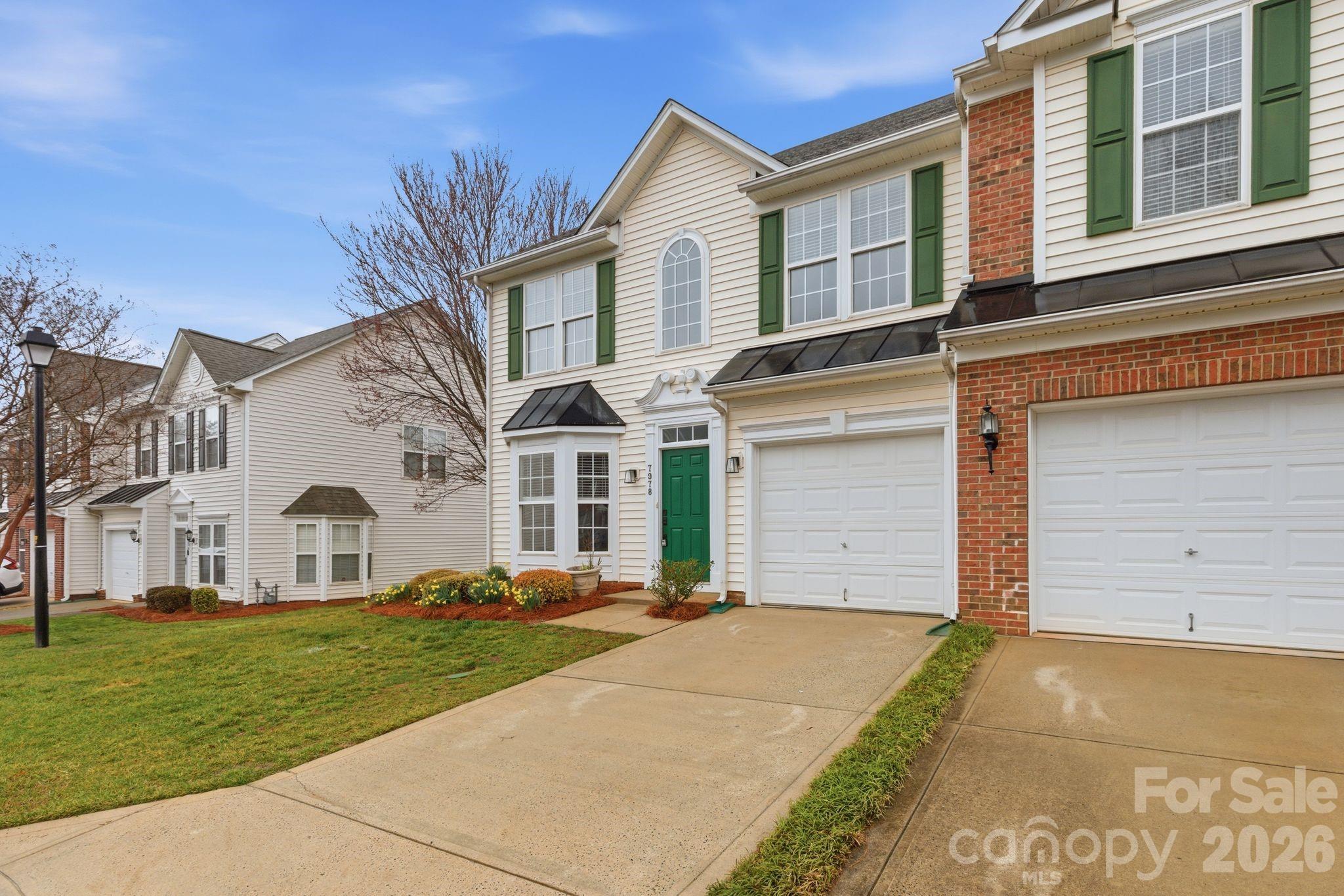 7978 Mariners Pointe Circle Denver, NC 28037 - Photo 36 of 37 a front view of a house with a yard