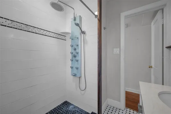 a bathroom with a shower and toilet