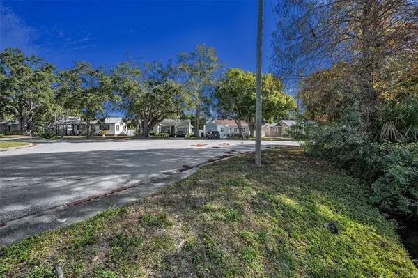 a view of a street with a building in the background