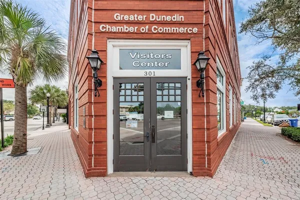 a front view of a building with sitting area