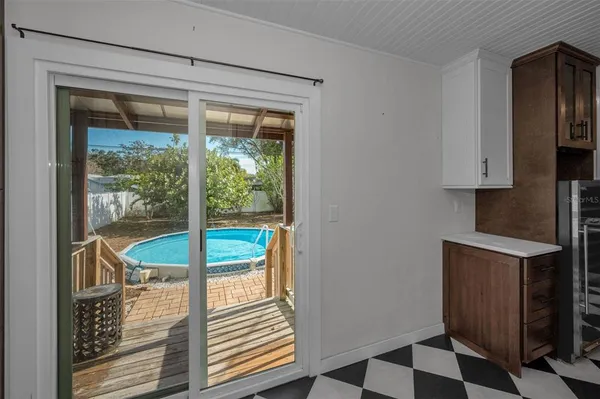 a view of a room that has a bed and a window