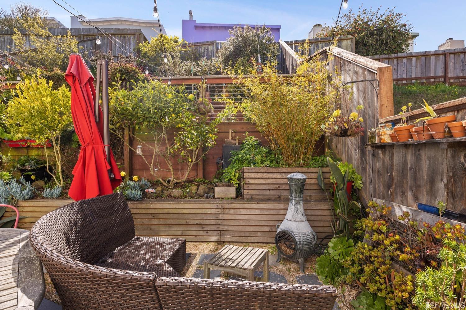 379 Winding Way San Francisco, CA 94112 - Photo 13 of 15 a view of roof deck with wooden floor and outdoor seating