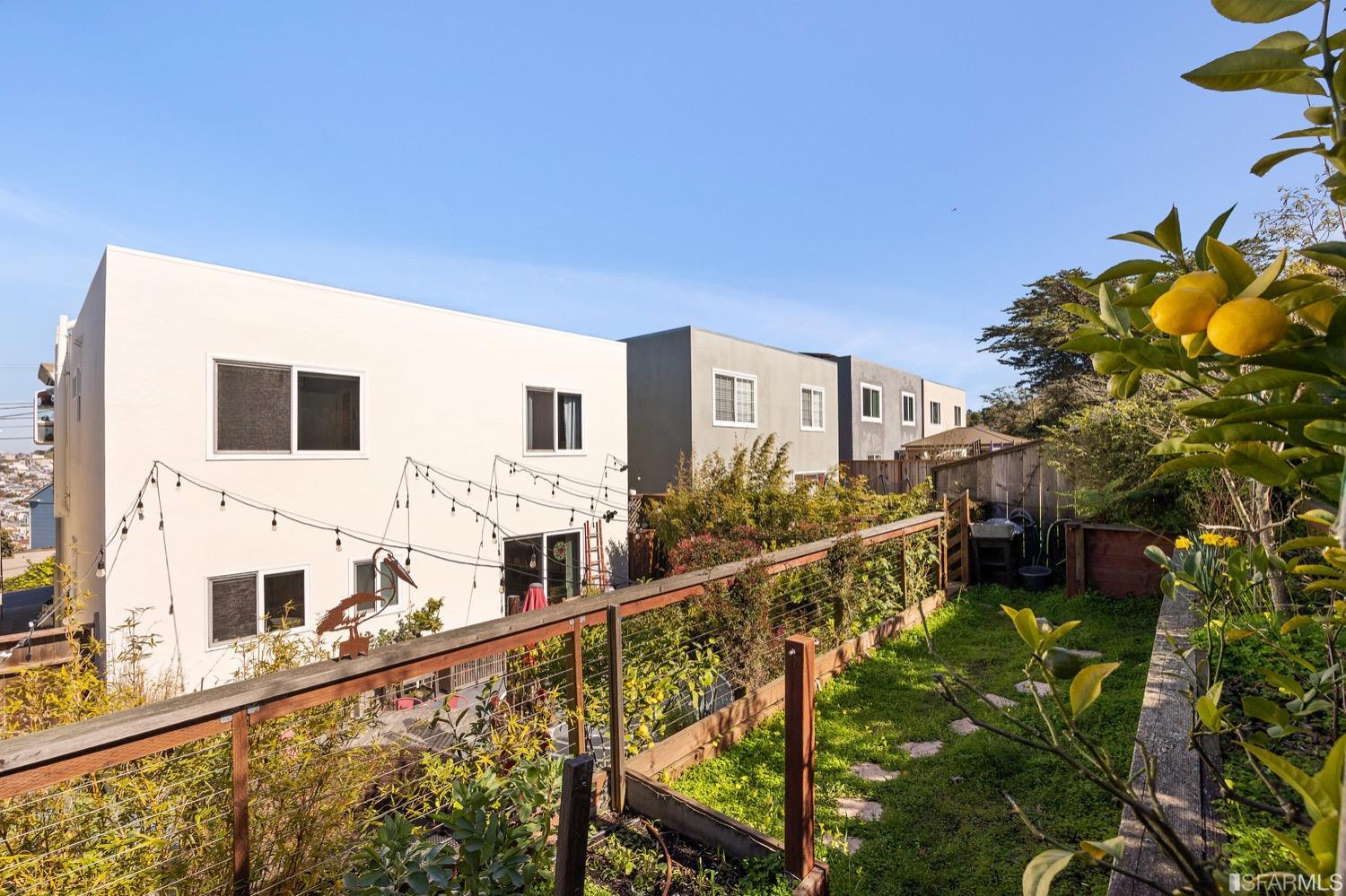 379 Winding Way San Francisco, CA 94112 - Photo 14 of 15 a view of a house with a small yard and potted plants