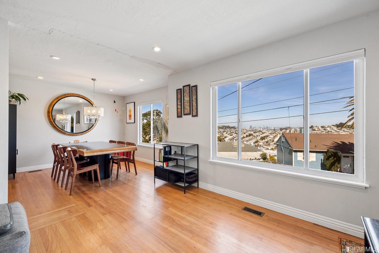 379 Winding Way San Francisco, CA 94112 - Photo 3 of 15 a view of a dining room with furniture window and wooden floor