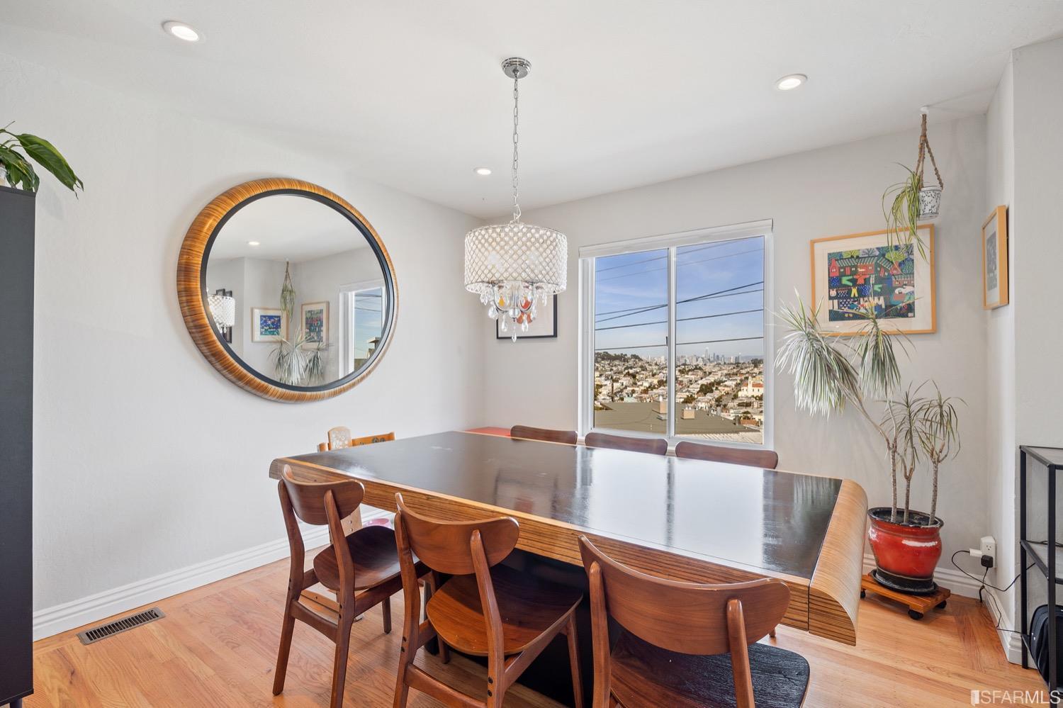 379 Winding Way San Francisco, CA 94112 - Photo 4 of 15 a dining room with furniture and a mirror