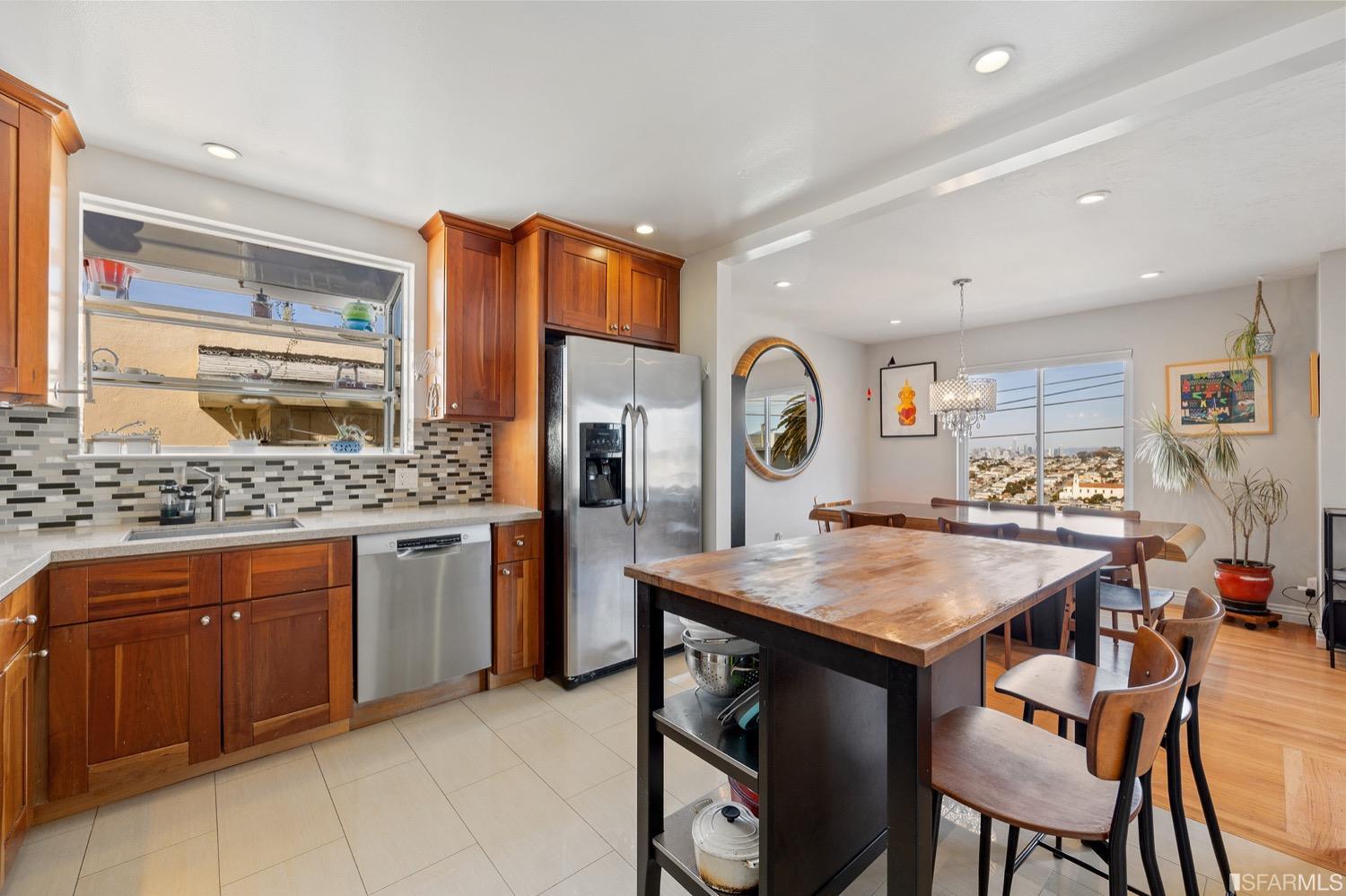 379 Winding Way San Francisco, CA 94112 - Photo 5 of 15 a kitchen with stainless steel appliances granite countertop a kitchen island a stove and a sink
