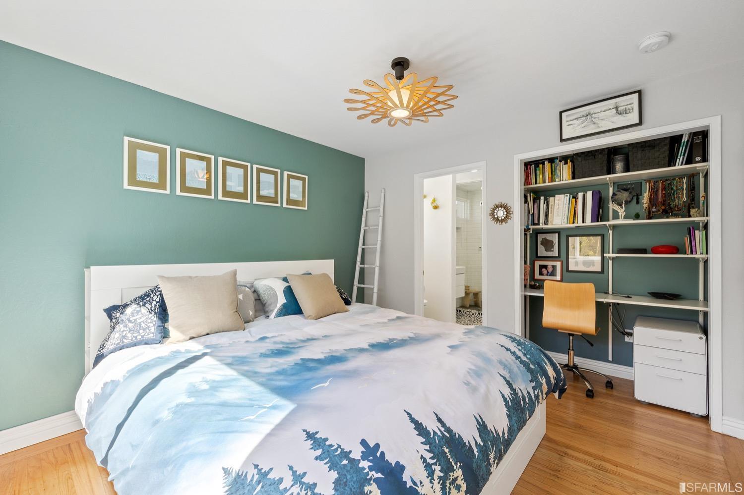 379 Winding Way San Francisco, CA 94112 - Photo 6 of 15 a bed sitting in a bedroom and a book shelf