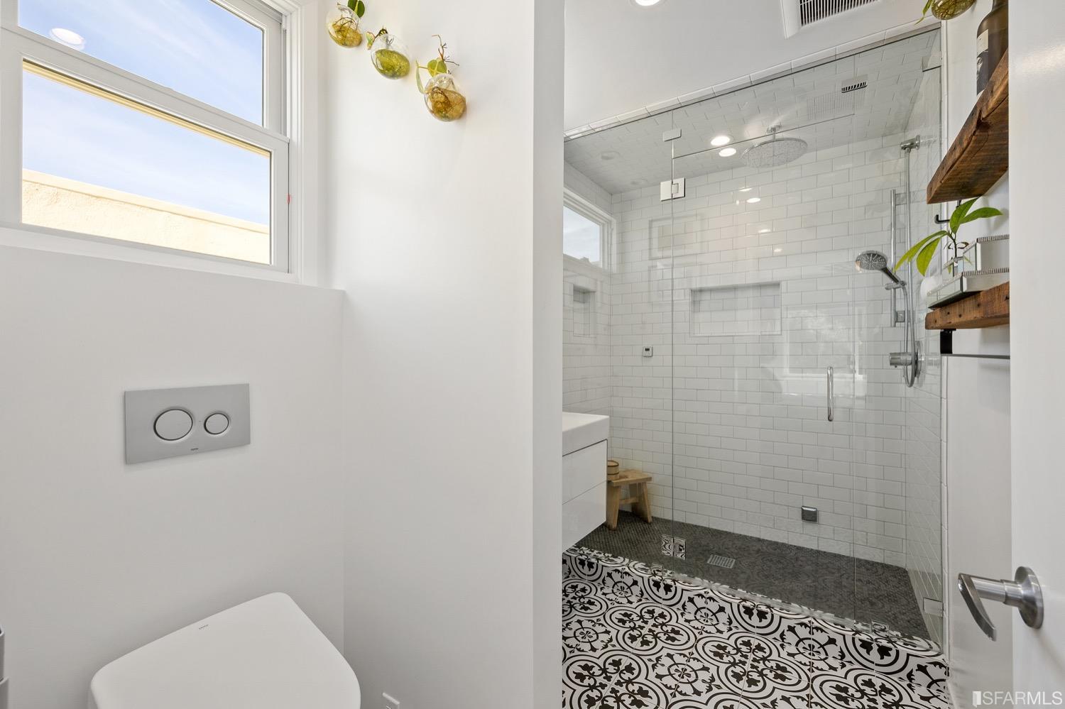 379 Winding Way San Francisco, CA 94112 - Photo 7 of 15 a bathroom with a toilet and a shower