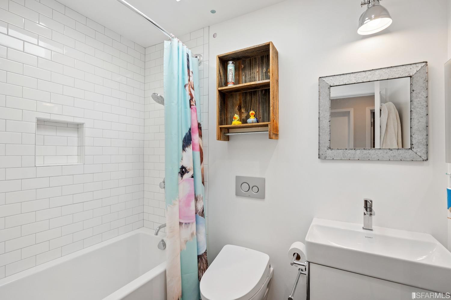 379 Winding Way San Francisco, CA 94112 - Photo 9 of 15 a bathroom with a toilet sink and mirror