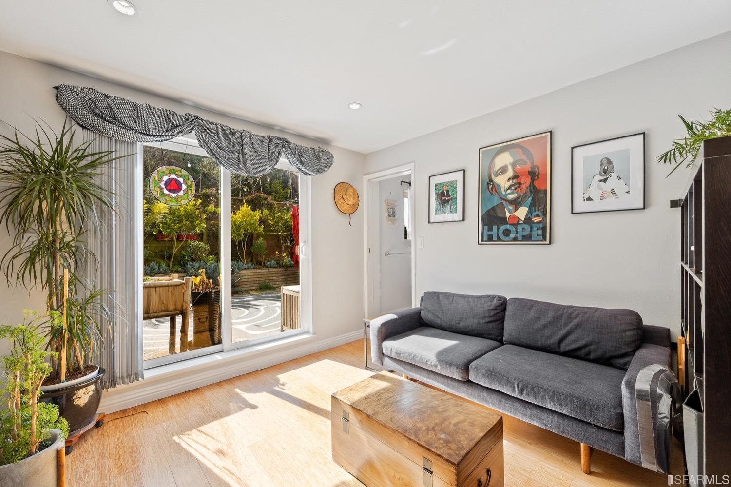 379 Winding Way San Francisco, CA 94112 - Photo 10 of 15 a living room with furniture and a floor to ceiling window