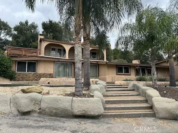 a front view of a house with balcony