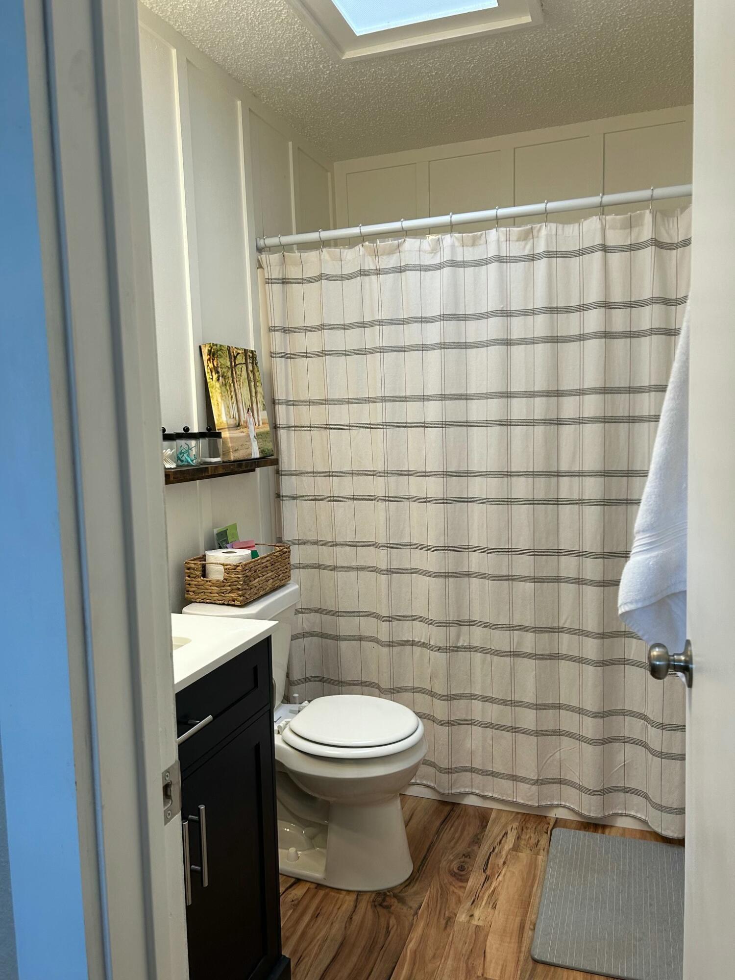 3006 County Road 3500 Lubbock, TX 79403 - Photo 15 of 23 a bathroom with a toilet and a shower