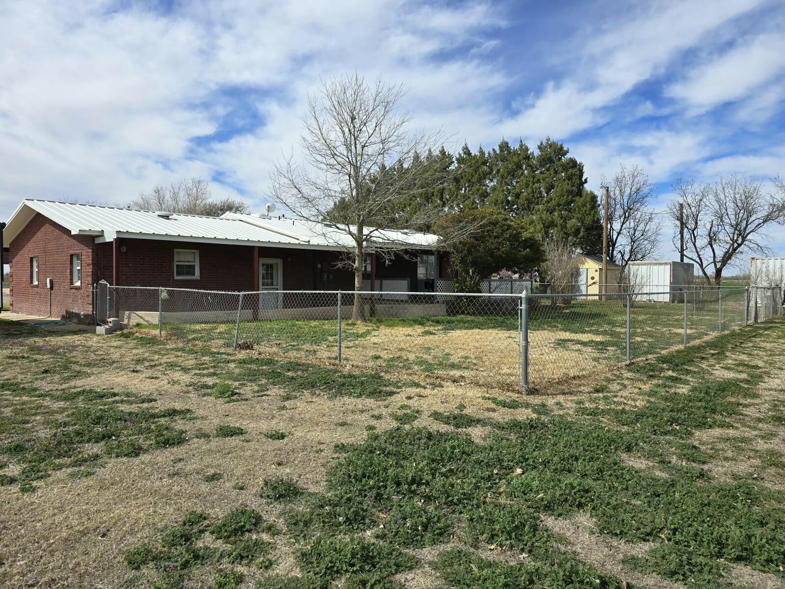 3006 County Road 3500 Lubbock, TX 79403 - Photo 22 of 23 a view of a house with a yard
