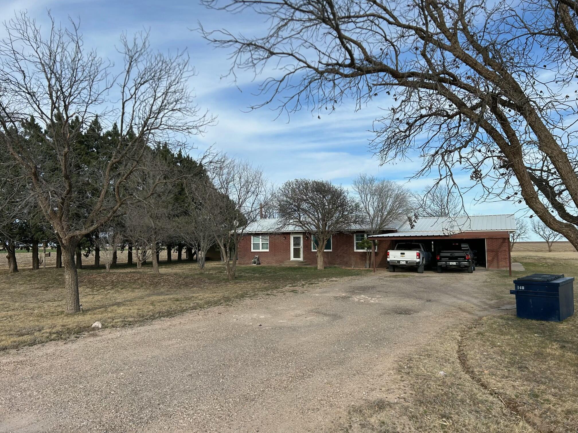 3006 County Road 3500 Lubbock, TX 79403 - Photo 3 of 23 a view of a house with a yard covered with snow in front of house