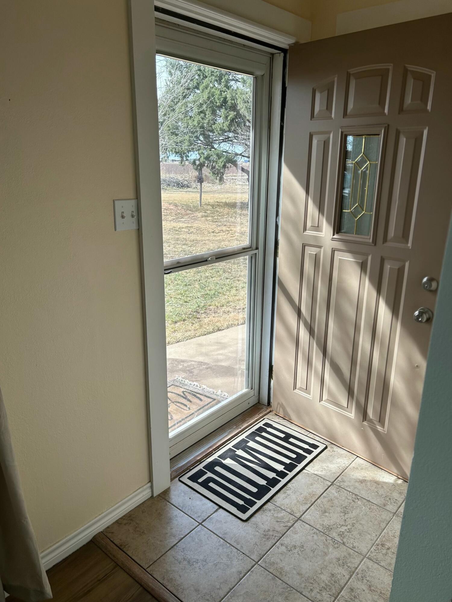 3006 County Road 3500 Lubbock, TX 79403 - Photo 5 of 23 a view of wooden floor in a livingroom