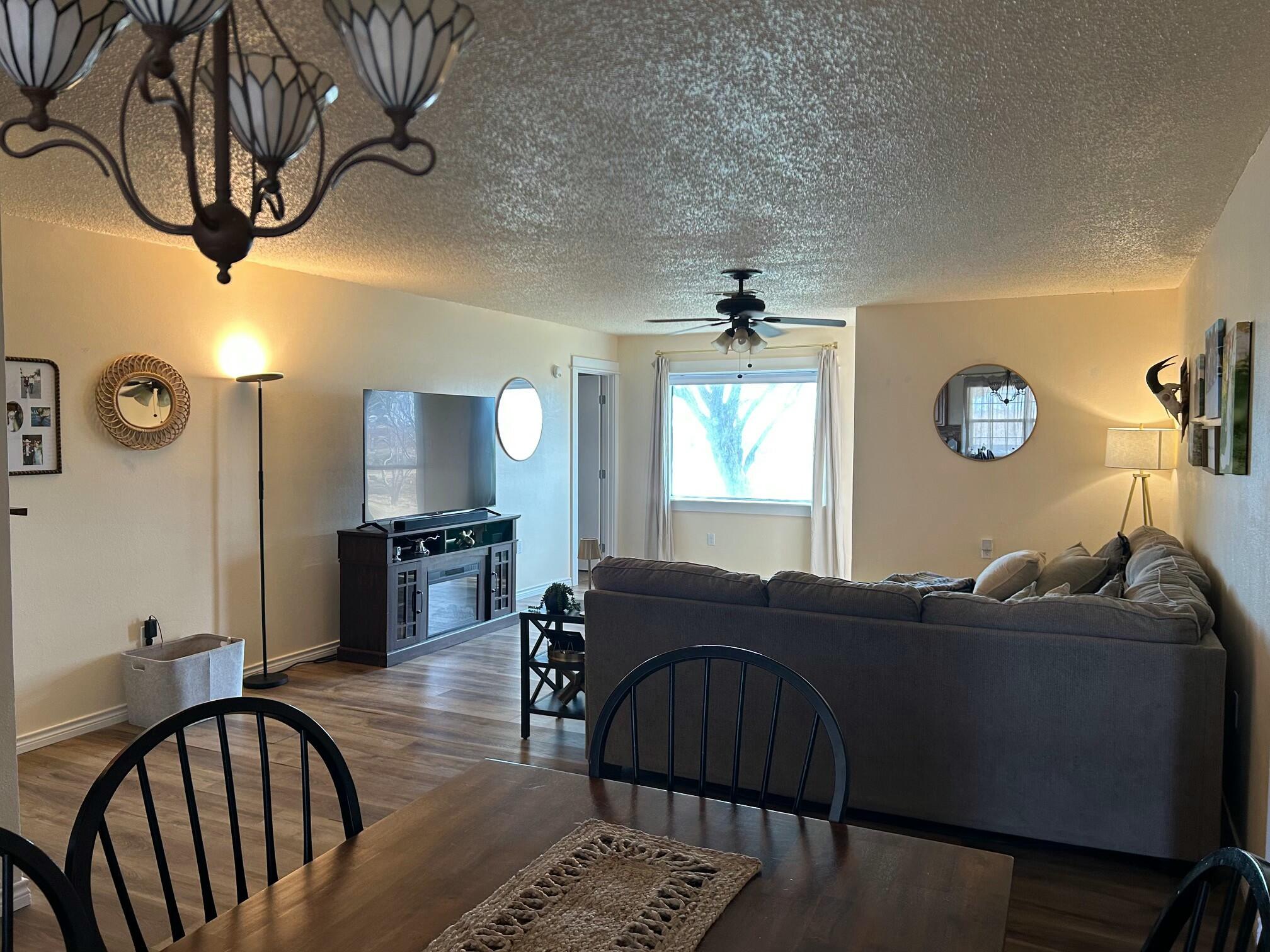 3006 County Road 3500 Lubbock, TX 79403 - Photo 7 of 23 a living room with furniture and a window
