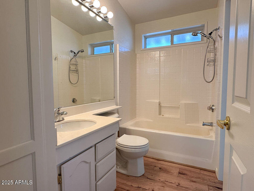 2054 North Thornton Road, Unit 187 Casa Grande, AZ 85122 - Photo 12 of 14 a bathroom with a granite countertop sink toilet and shower