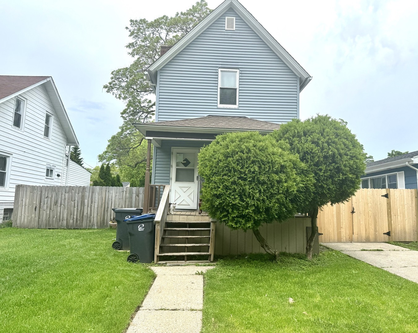 3232 Ezra Avenue Zion, IL 60099 - Photo 1 of 29 a view of a house with a yard and sitting area