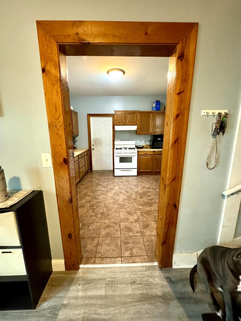 3232 Ezra Avenue Zion, IL 60099 - Photo 13 of 29 a view of a living room with a fireplace