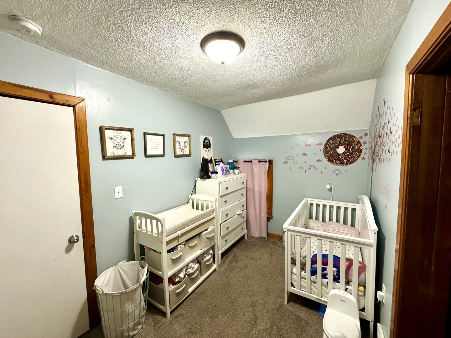 3232 Ezra Avenue Zion, IL 60099 - Photo 15 of 29 a bedroom with furniture and a baby crib