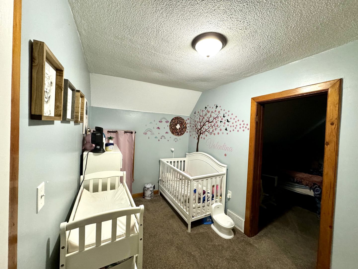 3232 Ezra Avenue Zion, IL 60099 - Photo 16 of 29 a room with furniture and a baby crib
