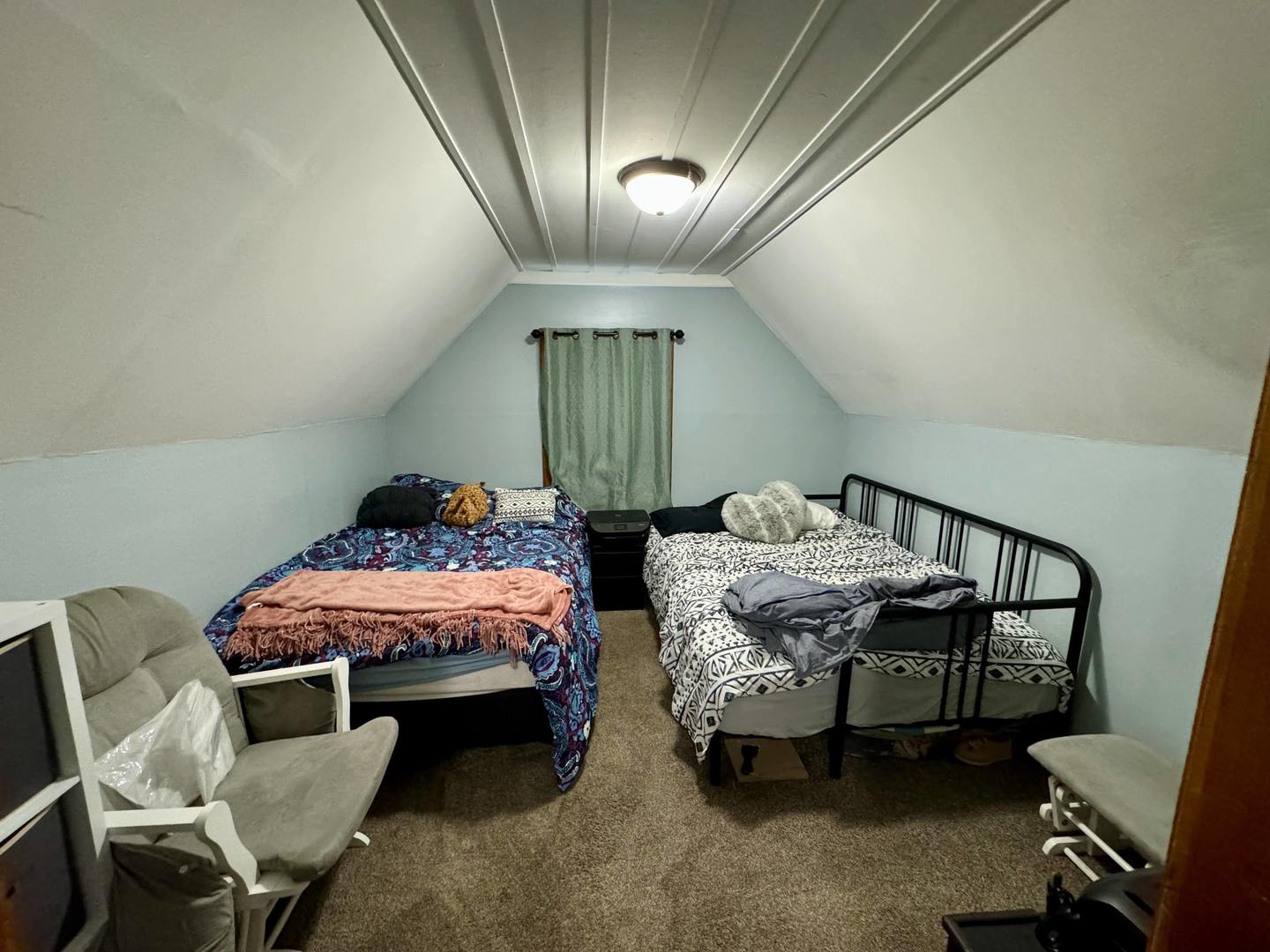 3232 Ezra Avenue Zion, IL 60099 - Photo 21 of 29 a bed room with furniture and a chandelier