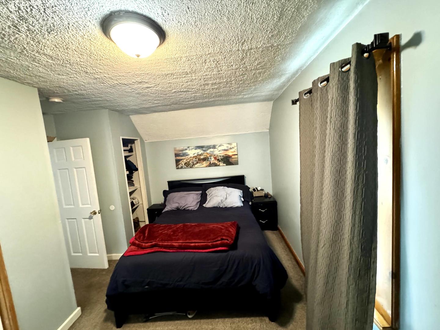 3232 Ezra Avenue Zion, IL 60099 - Photo 24 of 29 a bedroom with a bed and a mirror