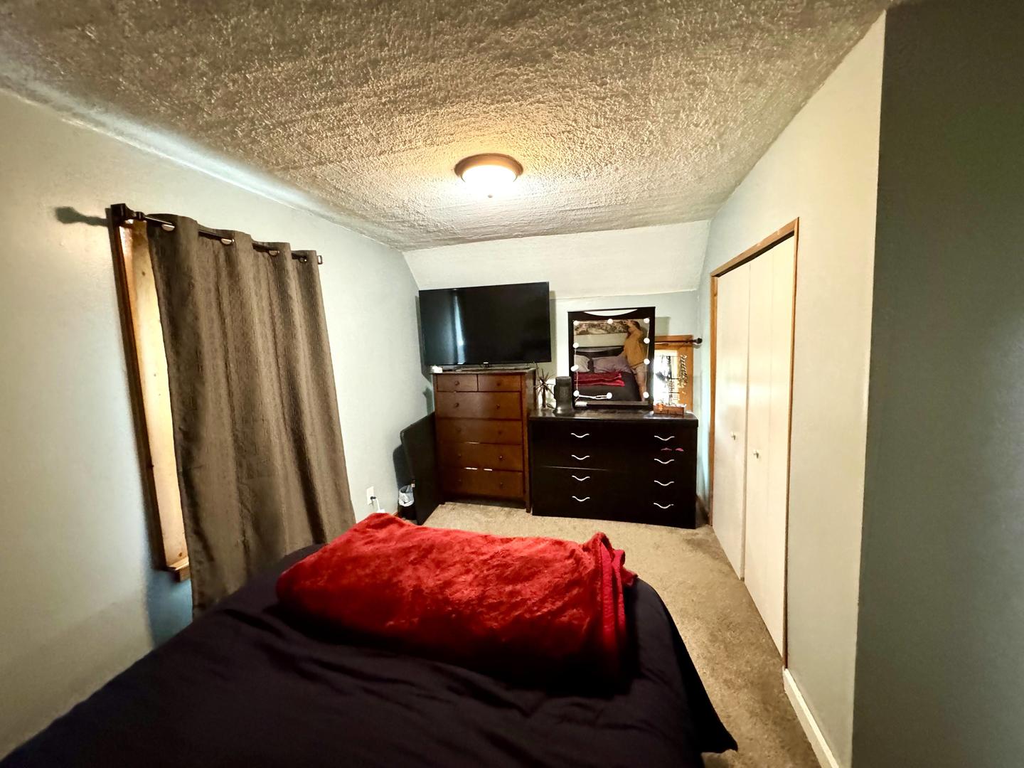 3232 Ezra Avenue Zion, IL 60099 - Photo 25 of 29 a bed room with a bed and a television