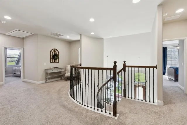 a view of a hallway with seating area