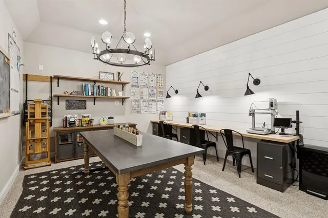 a kitchen with a table and chairs