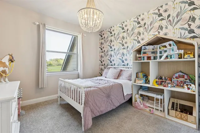 a bedroom with bed and a window