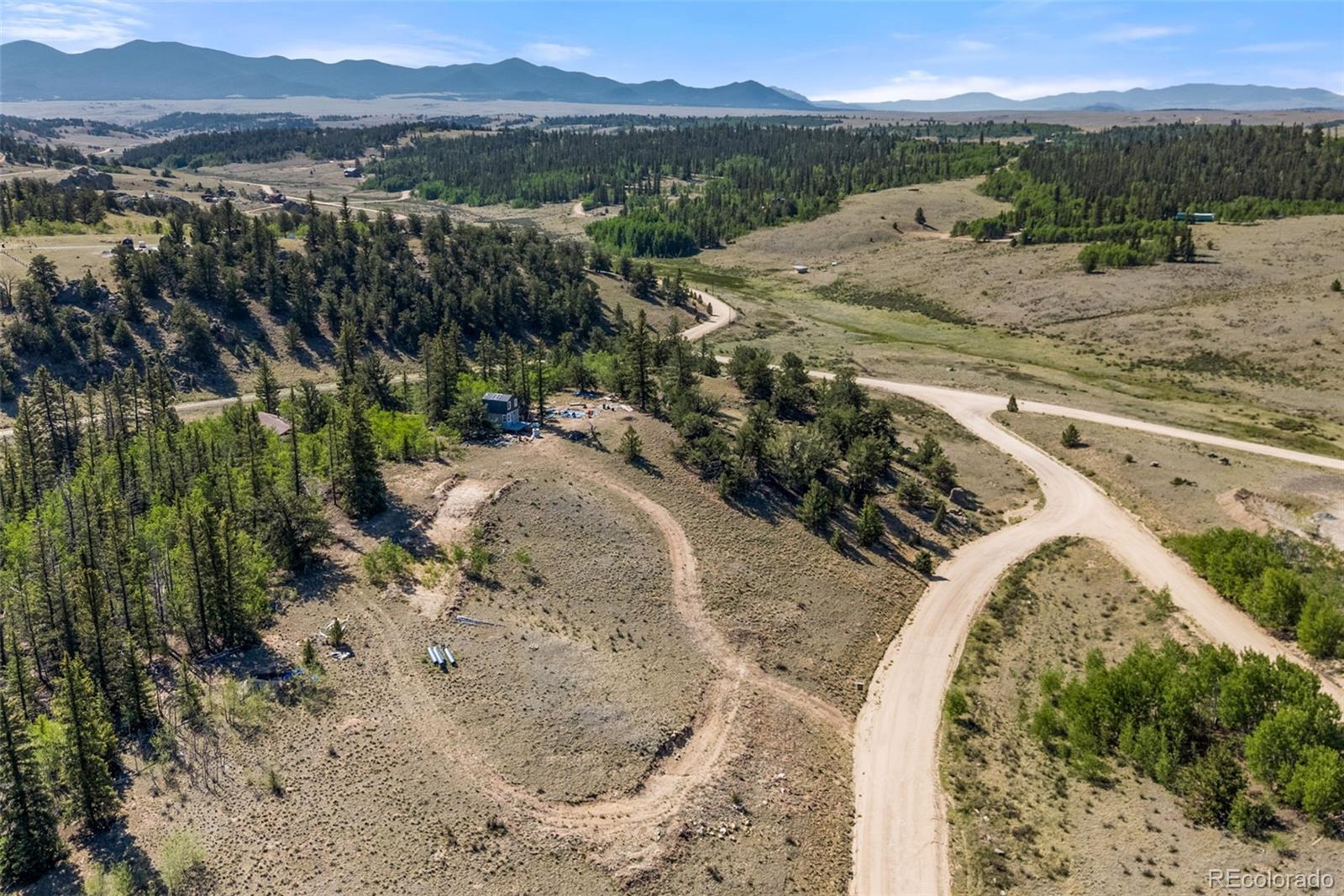 4588 Remington Road Jefferson, CO 80456 - Photo 2 of 11 a view of a lake with a mountain