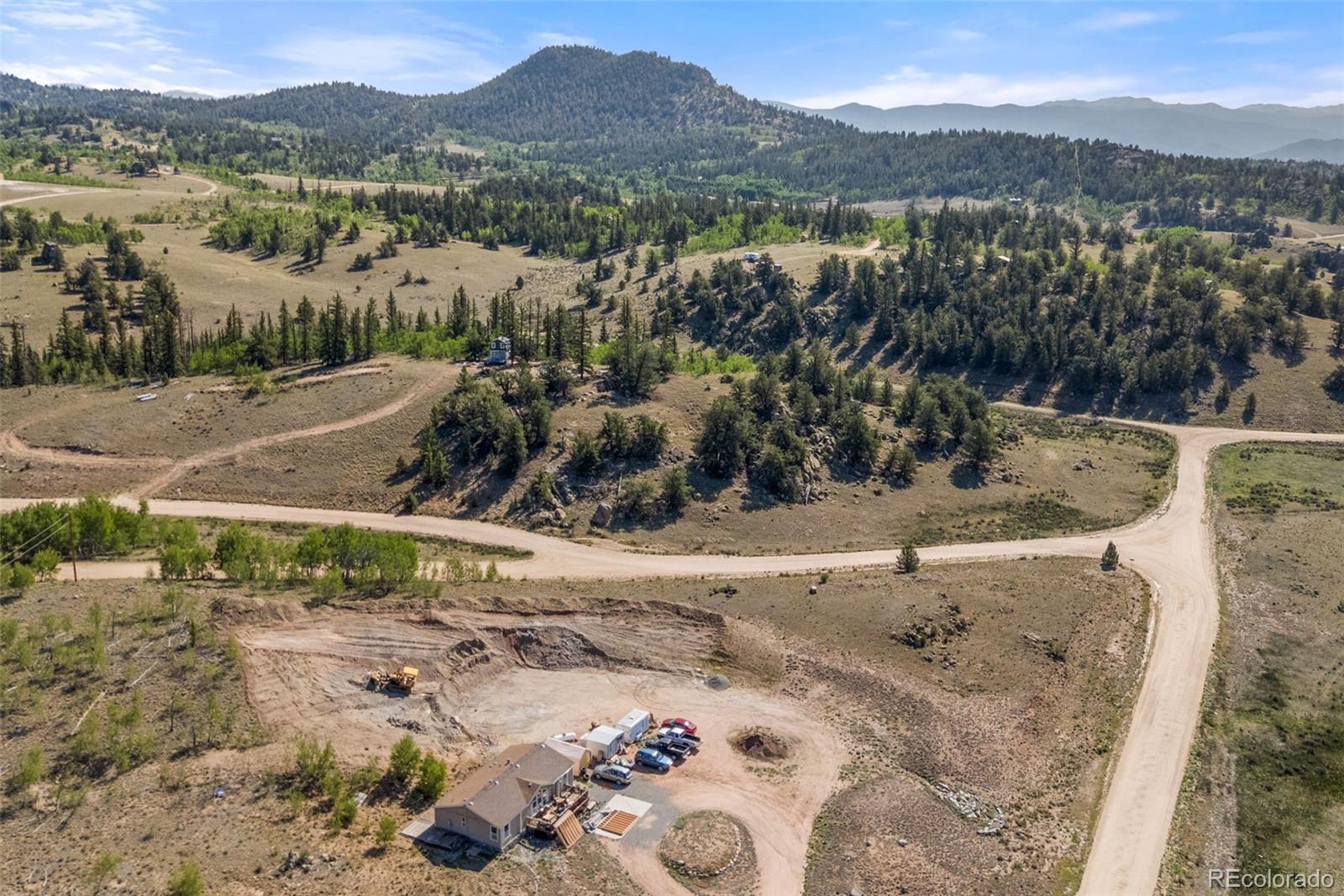 4588 Remington Road Jefferson, CO 80456 - Photo 4 of 11 a view of a forest with a lake