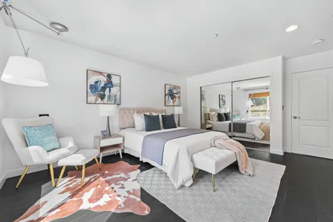 a bedroom with a bed and a table