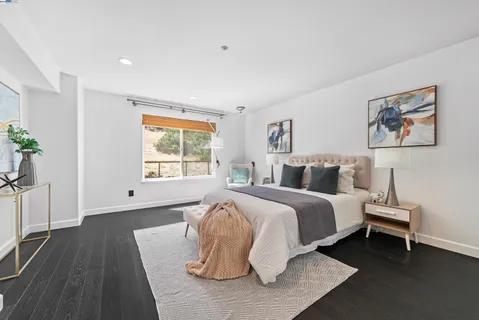 a bed room with a bed and a night stand