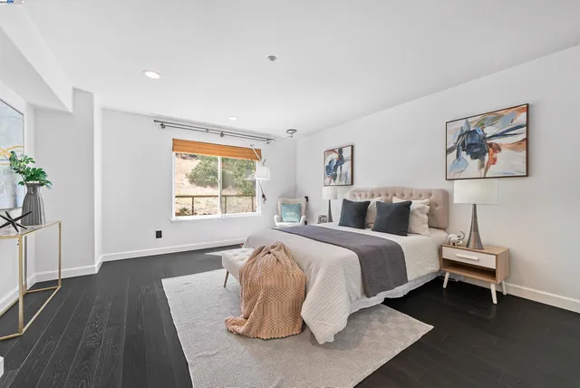 a bed room with a bed and a night stand