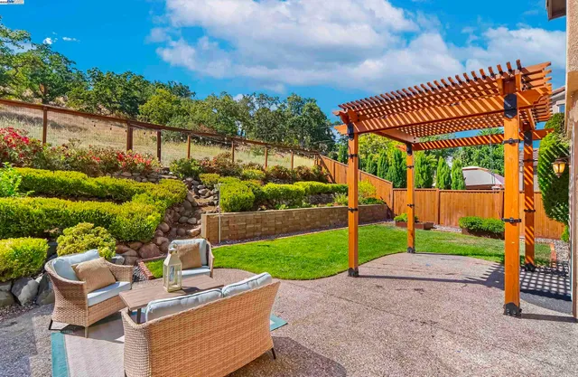 a view of yard with patio