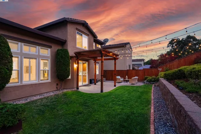 a view of a house with a yard porch and sitting area