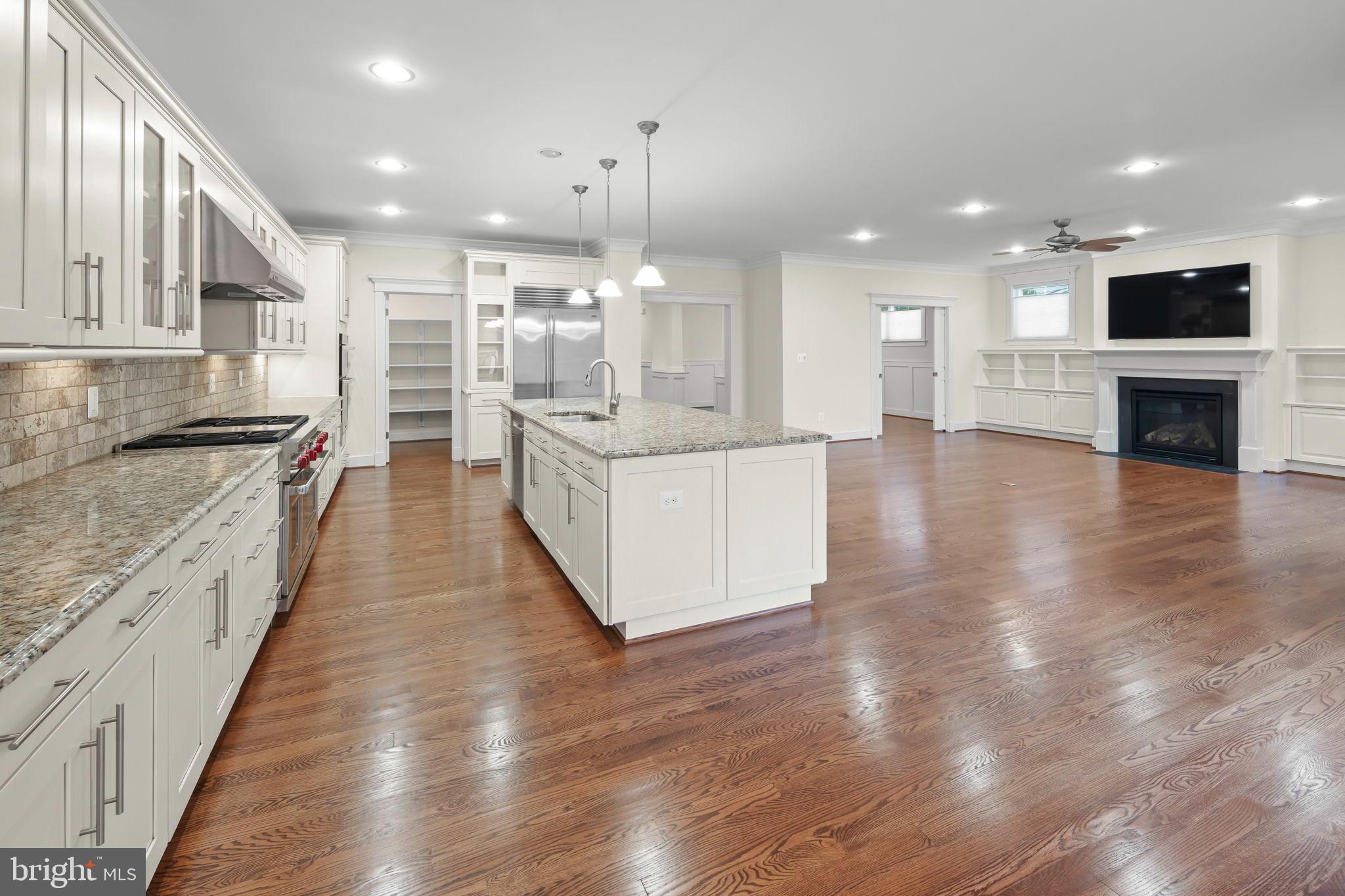 217 Pleasant Street Southwest Vienna, VA 22180 - Photo 21 of 80 a large kitchen with stainless steel appliances kitchen island a large counter top and a wooden floors