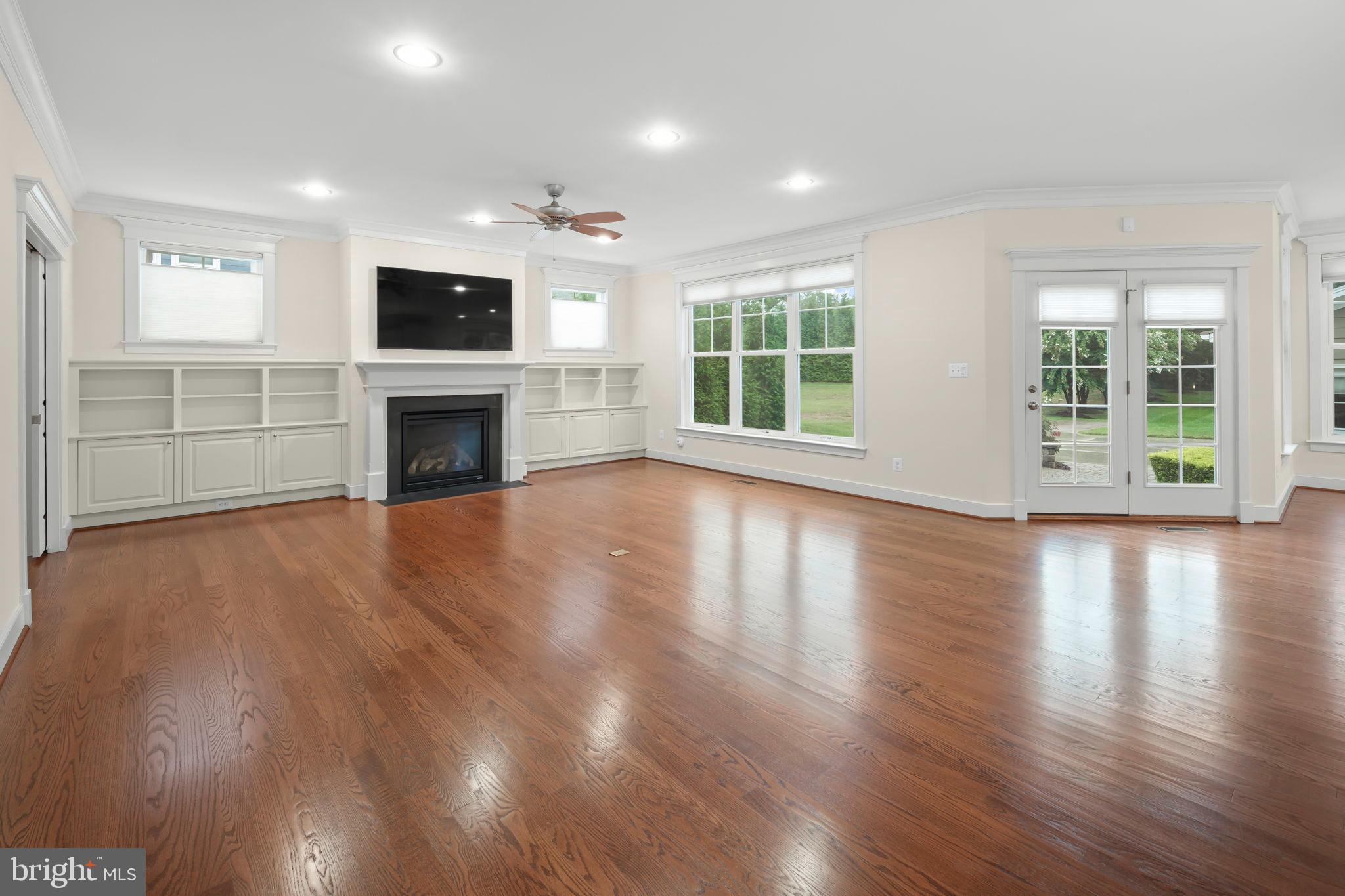 217 Pleasant Street Southwest Vienna, VA 22180 - Photo 24 of 80 a view of an empty room with wooden floor and a window