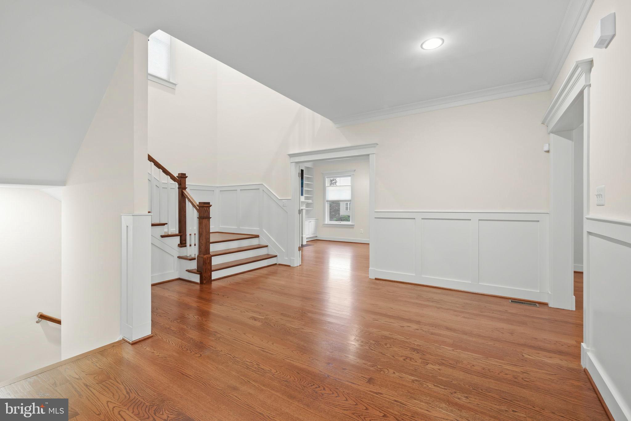 217 Pleasant Street Southwest Vienna, VA 22180 - Photo 26 of 80 a view of an empty room with wooden floor and a window