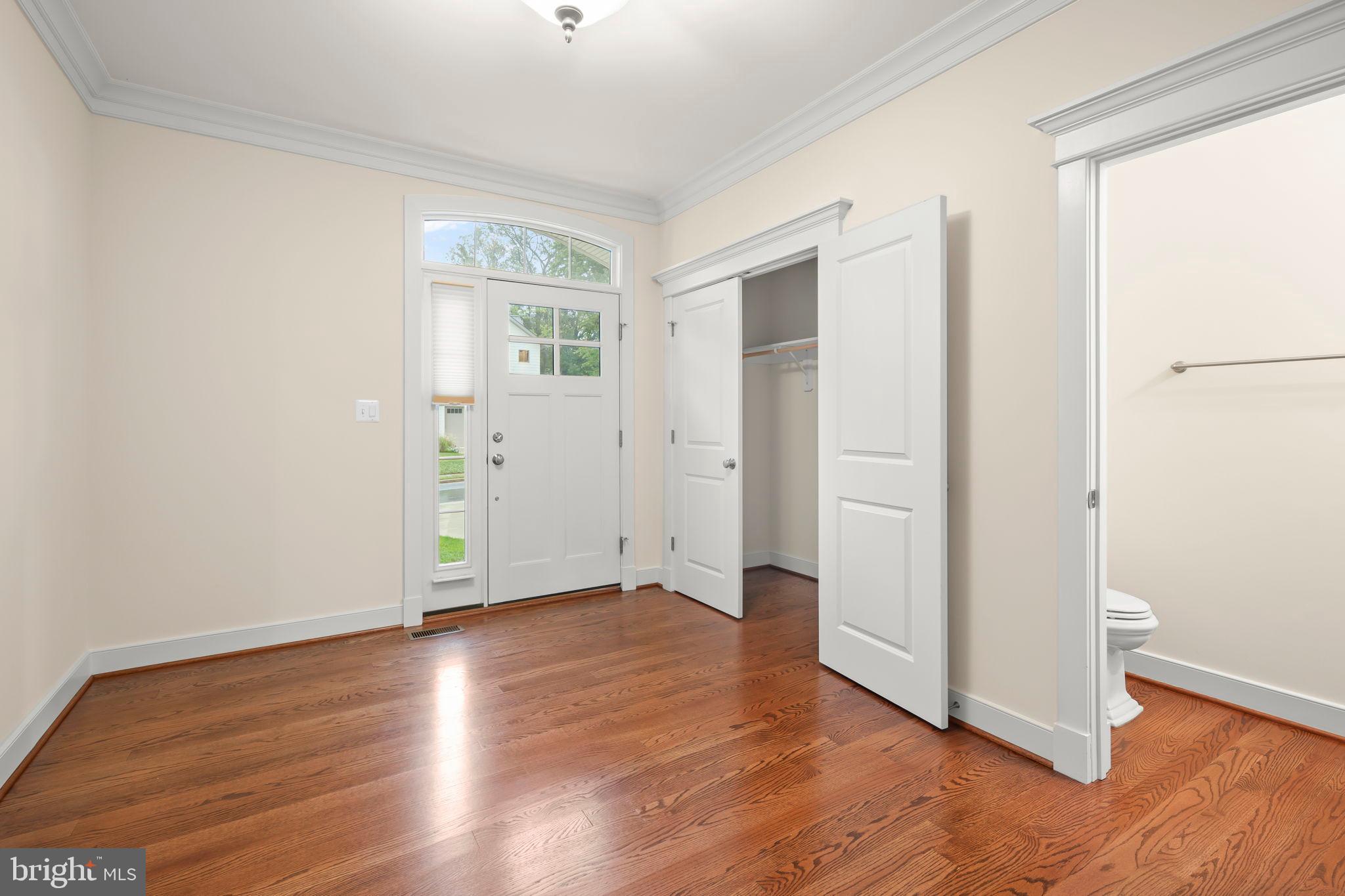 217 Pleasant Street Southwest Vienna, VA 22180 - Photo 42 of 80 an empty room with wooden floor and windows